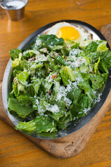 Salad. Classic American or French restaurant salad made w/ kale, Arugula, almonds, blueberries, walnuts, tomatoes, bacon, blue cheese, avocado, tossed w/ olive oil.