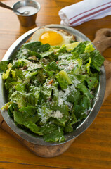 Salad. Classic American or French restaurant salad made w/ kale, Arugula, almonds, blueberries, walnuts, tomatoes, bacon, blue cheese, avocado, tossed w/ olive oil.