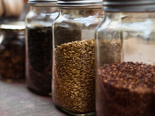 Jars with whole foods traditional grains.