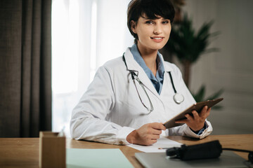 portrait of a female doctor during a consultation with a patient