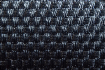 Fullscreen macro close-up with shallow depth of field of a kevlar-like texture. Graphic design.