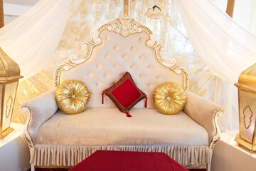 The interior is in oriental style. Decoration for henna party. Mehndi decoration.