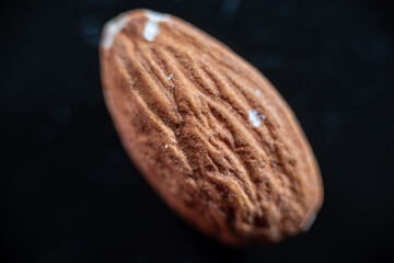 Closeup of shiny peeled almond seeds. Peeled almond texture. Superfood. Natural food.