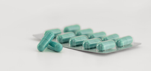 Pile of scattered capsules on a white background. capsules isolated white capsule pharmacy bottle pill drug concept