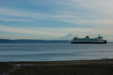 Bainbridge Island ferry crossing in Puget Sound against backdrop of Mount Rainier