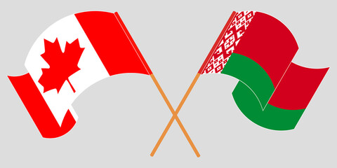 Crossed and waving flags of Belarus and Canada