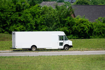 Blank White Panel Truck Exits Freeway Against Green Background