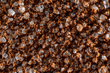 Fullscreen macro close-up with shallow depth of field of sugar mixed with instant coffee. Texture. Graphic design.