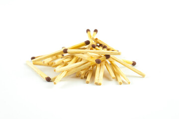 A pile of matches on a white background.