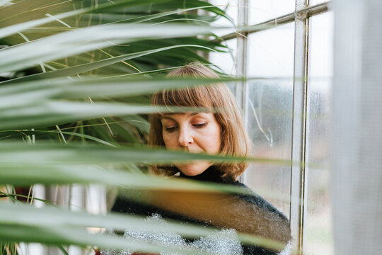 Woman in greenhouse