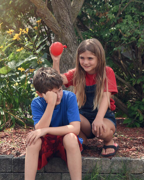 Child Ready to Pop Water Balloon
