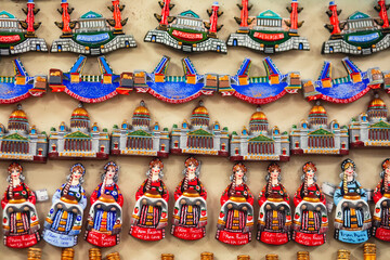 View of traditional souvenirs from Saint-Petersburg, Russia, with fridge magnets of russian dolls,...