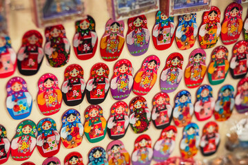 View of traditional souvenirs from Saint-Petersburg, Russia, with fridge magnets of russian dolls,...
