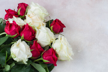 bouquet of white and red roses on a light background