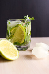 Mojito cocktail with lime and mint in highball glass on background Copy space