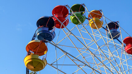 Several multi-colored cabins of ferris wheel