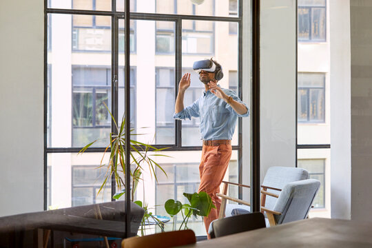Businessman Standing by the Window Using Vr Headset
