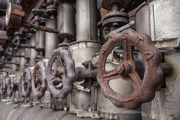 detail of an old rusty metal valve handle