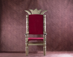 medieval royal throne with on a red background