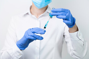 female doctor holding syringe