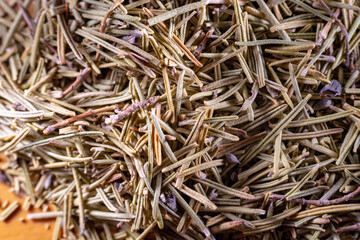 Closeup of dried rosemary leaves. Rosemary texture. Very popular and healthy seasoning worldwide.