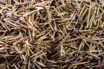 Closeup of dried rosemary leaves. Rosemary texture. Very popular and healthy seasoning worldwide.