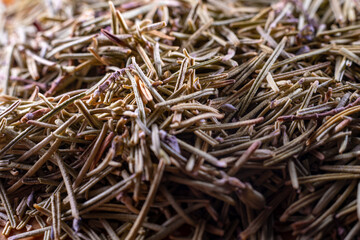 Closeup of dried rosemary leaves. Rosemary texture. Very popular and healthy seasoning worldwide.