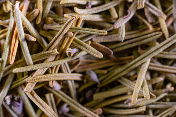 Closeup of dried rosemary leaves. Rosemary texture. Very popular and healthy seasoning worldwide.