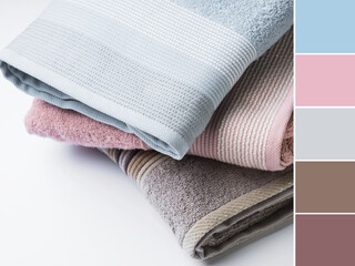 Pastel color clean folded towels on white background. Color swatch - 363657210