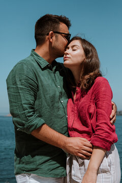 Tender couple by the sea.