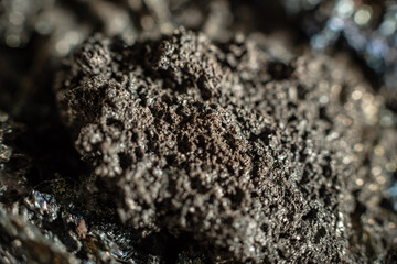Macro of slag or volcanic magma stone texture, similar to a landscape of a strange space planet