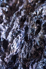 Macro of slag or volcanic magma stone texture, similar to a landscape of a strange space planet