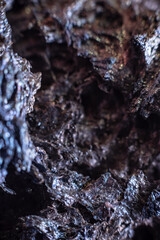 Macro of slag or volcanic magma stone texture, similar to a landscape of a strange space planet