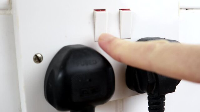 Unplugging A British Plug From The Socket