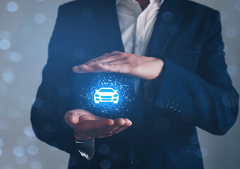 Hand of businessman with protective gesture and icon of car. Car insurance or  automobile concept.