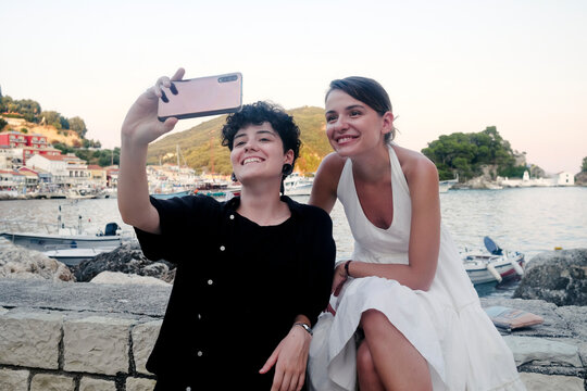 Two female models taking selfies on the mobile phone