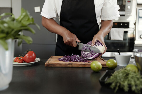 Woman Shredding Red Cabbage