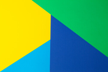 Abstract geometric shape yellow, blue, green color paper background