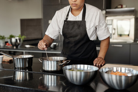 Woman Wearing Apron Working In Cafe
