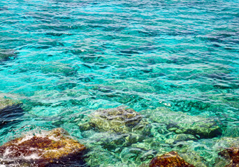 Transparent turquoise sea and colorful stones in the Mediterranean Sea in Cyprus