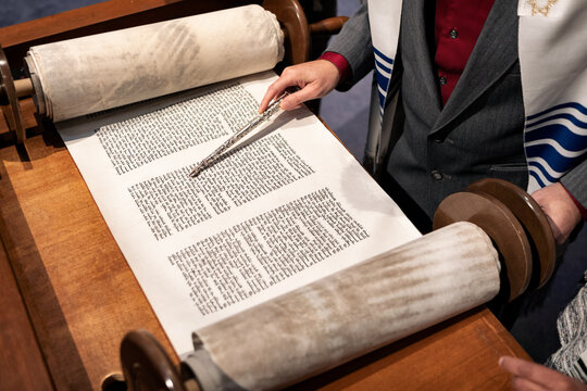 Synagogue: Man Using Pointer While Reading From Torah