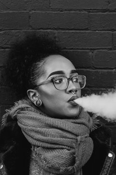 A young woman vaping