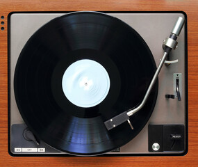 vintage seventies recordplayer with spinning vinyl