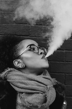 A young woman vaping