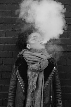 A young woman vaping
