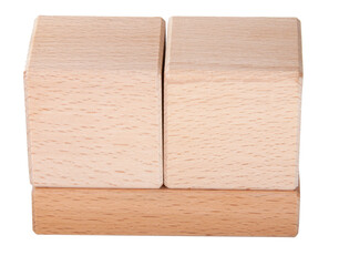 two wooden cubes on one brick create construction isolated on the white