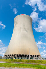 Cooling tower of nuclear power plant. On sunny day with blue sky and white clouds