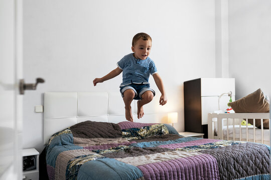 Boy having fun on bed