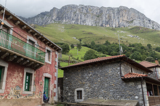 Abrupt mountain over village houses