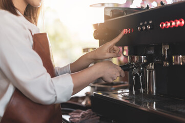 Close up image of barista preparing coffee at cafe